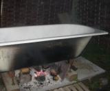 Wood fired cast iron bath tub