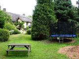 Large garden with trampoline