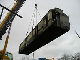 Old travelling post office being craned in